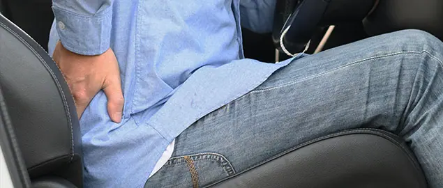 patient with back injury needing auto accident chiropractor in Ontario