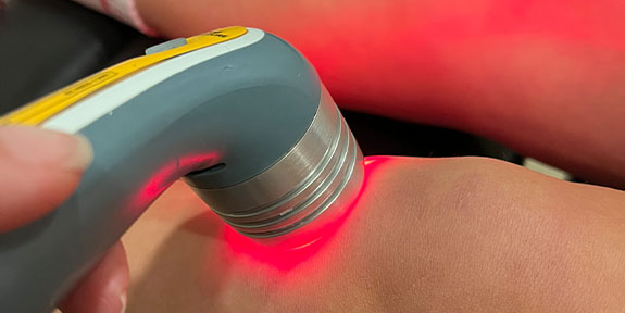 patient getting laser in Ontario for auto accident injury